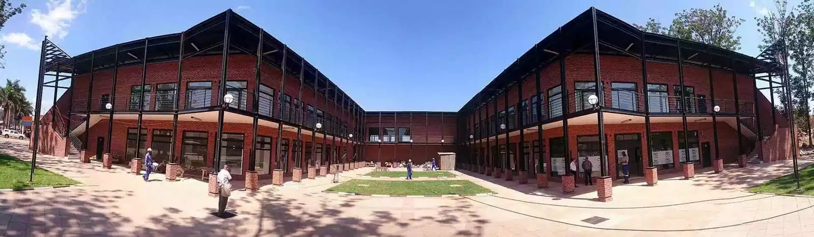 Modern symmetrical building wings with covered walkways in facebrick in Chipinge