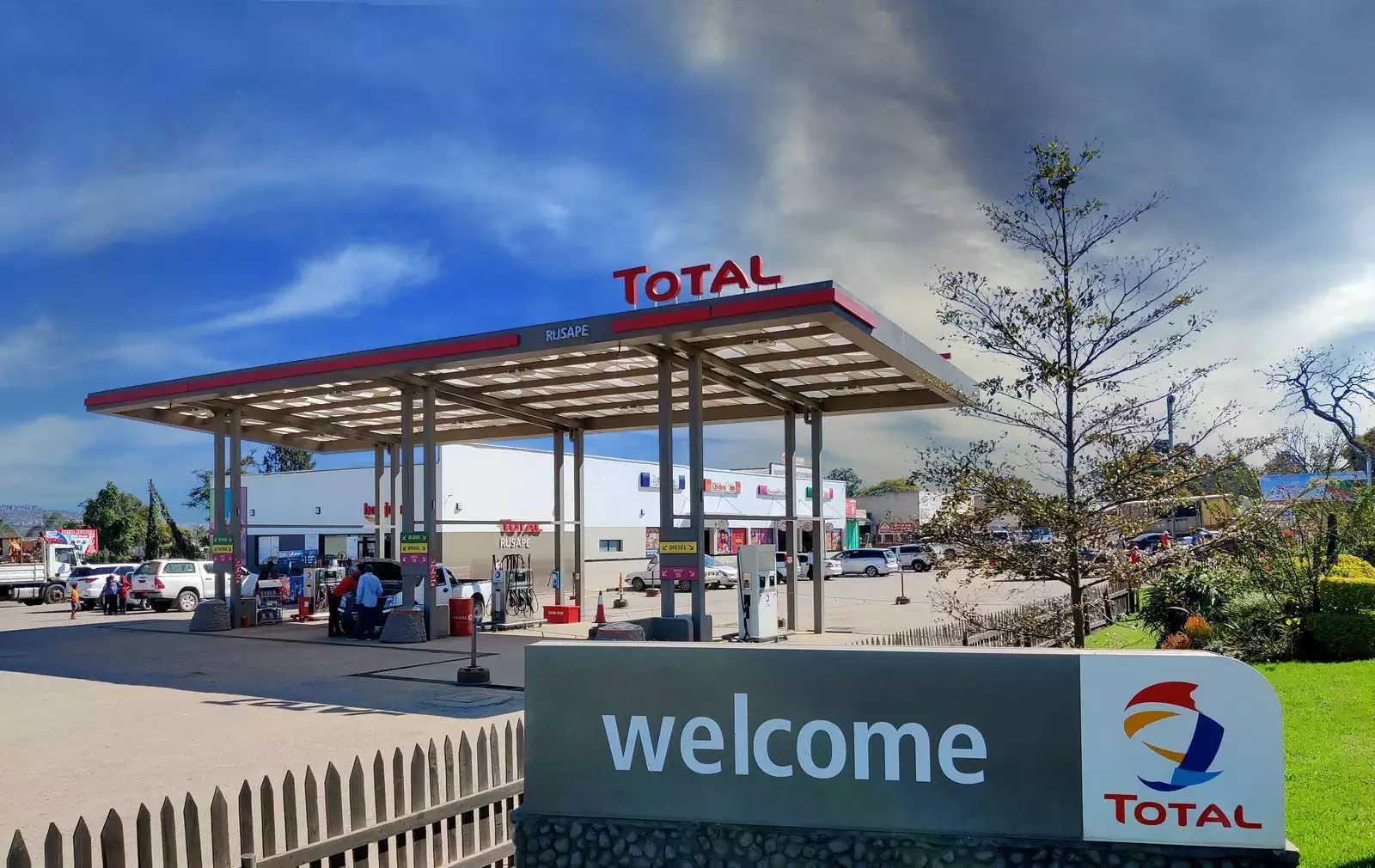 Iconic welcome sign with branded canopy on petrol station in Rusape
