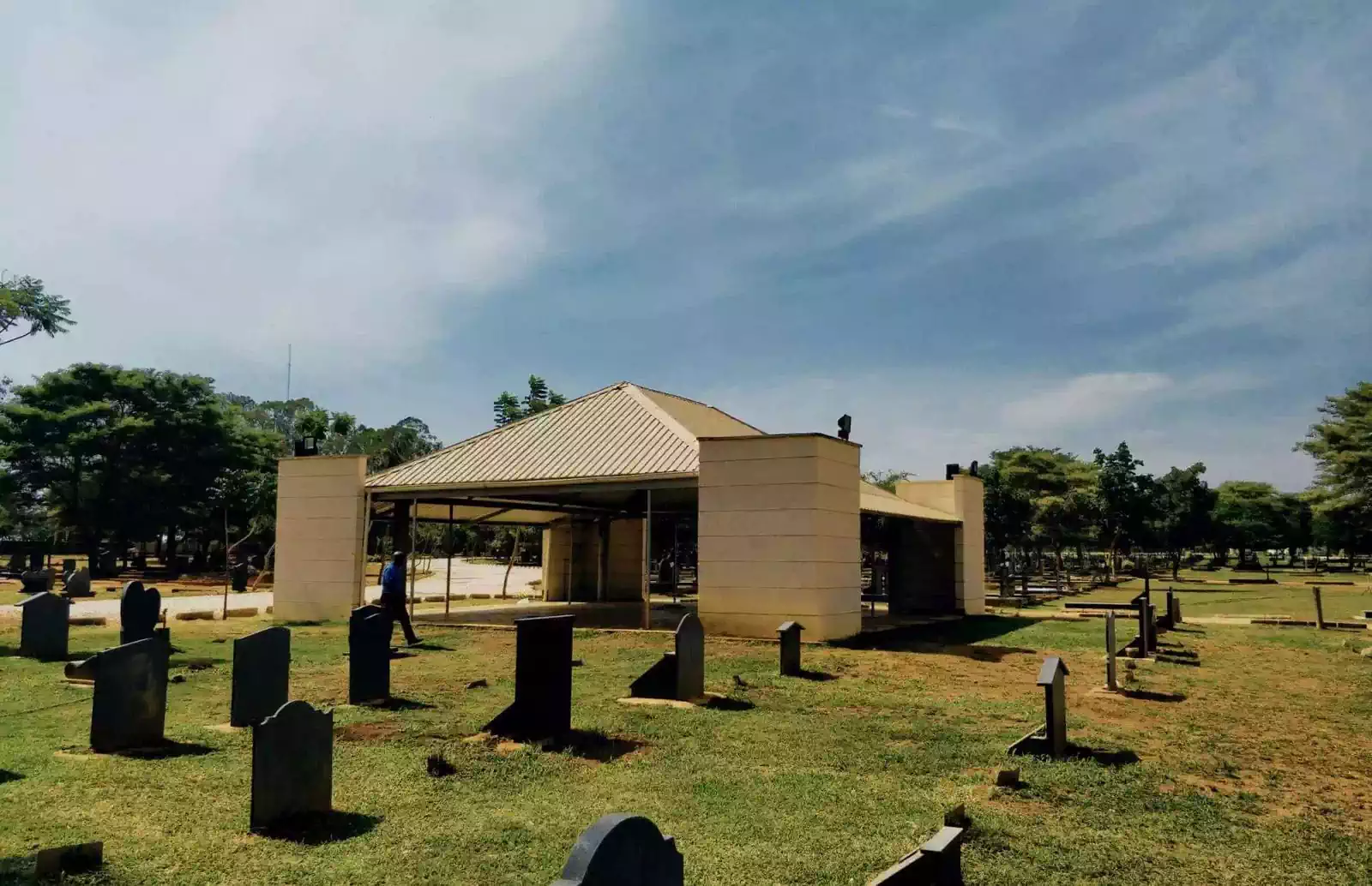 Modern serene chapel amongst graves in Serene newly built graveyard with tombstones in Leopard's Hill Memorial Park, Lusaka 