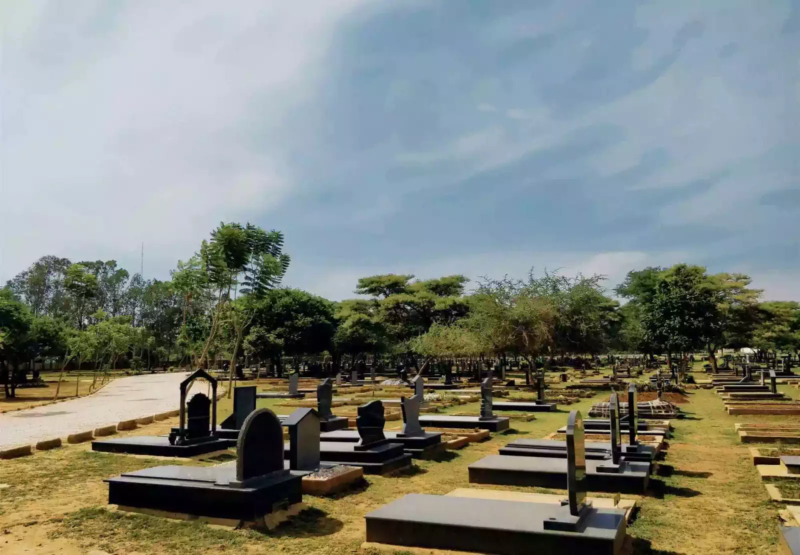 Serene newly built graveyard with tombstones in Leopard's Hill Memorial Park, Lusaka 