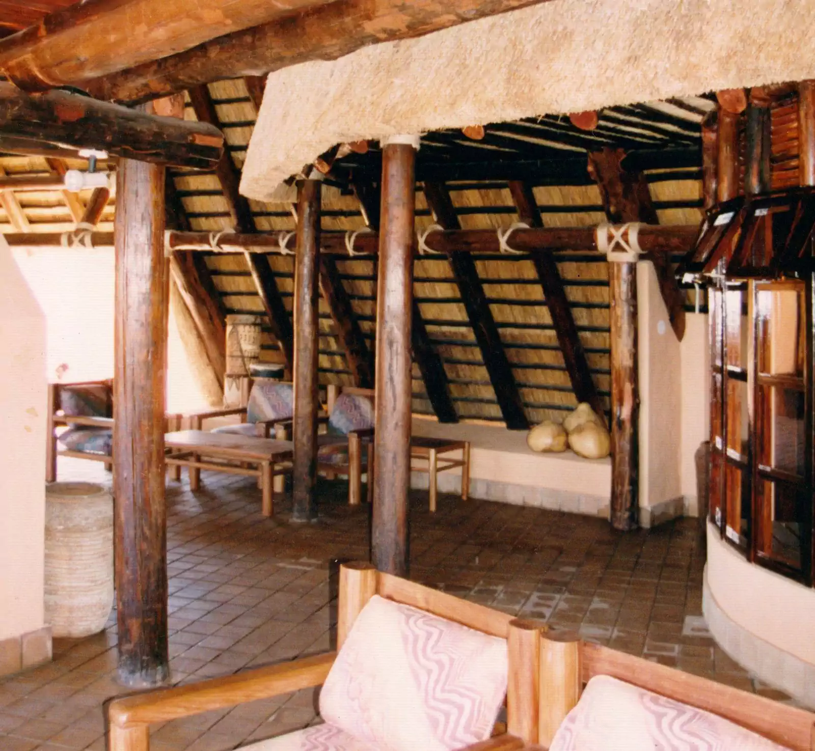 Large thatched roof entrance with engraved elephant lodge in Zimbabwe