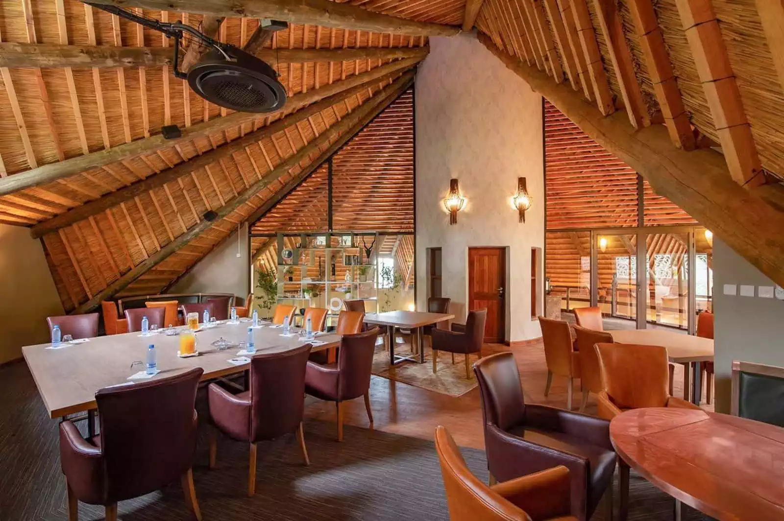 Interior view of dining area under gum poles and thatch