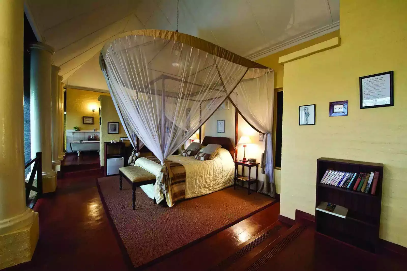 Luxurious colonial look lodge bedroom in Zambian lodge designed by architect 