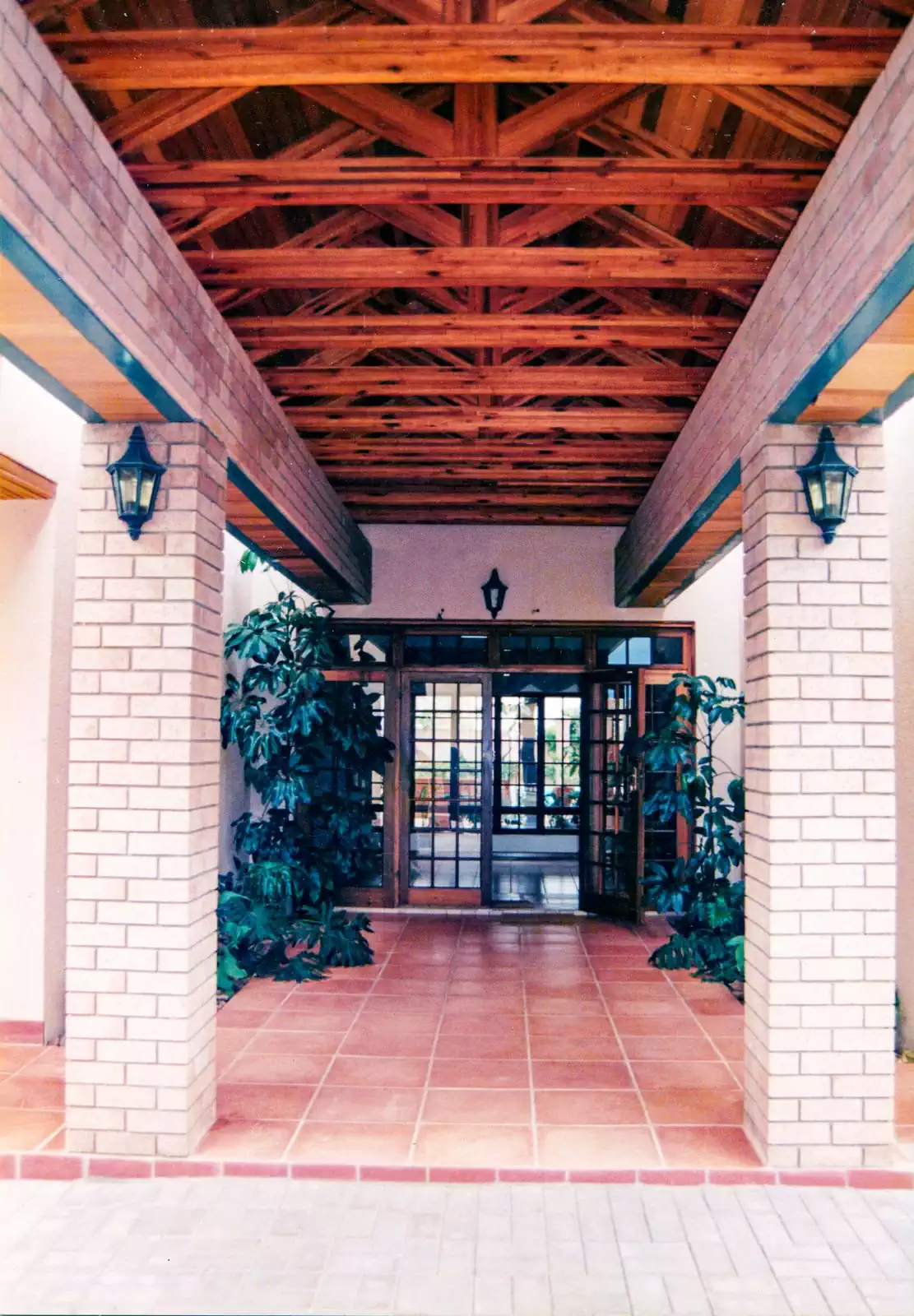 Contemporary symmetrical brick house with covered veranda in Gaborone, Botswana