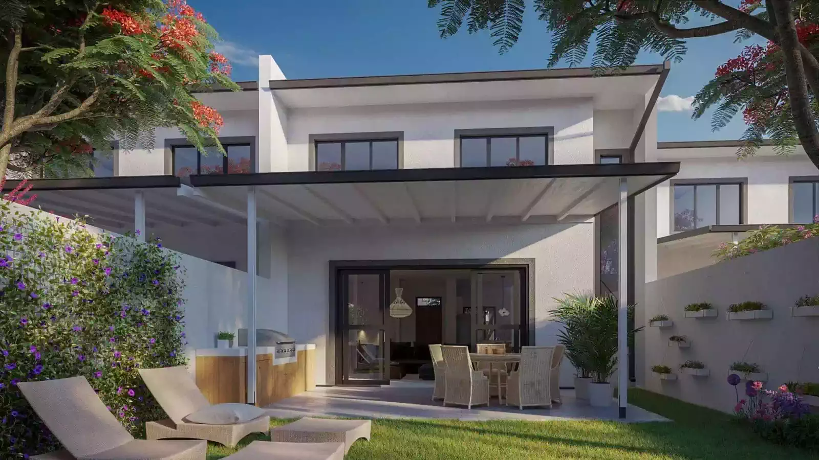 Townhouse backyard with loungers, dining and cooking area covered by timber roof which provides shade and comfort