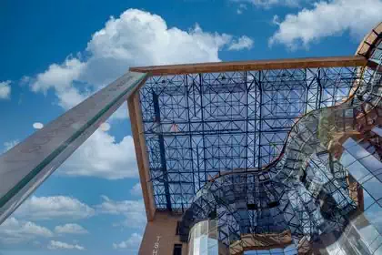 Ondulating glass facade and trellissed roof structure modern design of Botswana Savings Bank headquarters