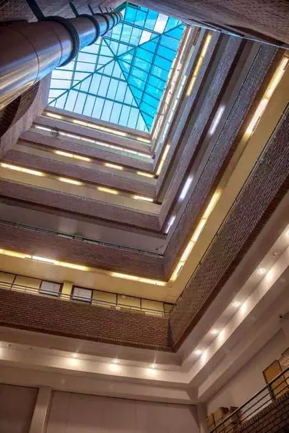 Ondulating glass facade and trellissed roof structure modern design of Botswana Savings Bank headquarters