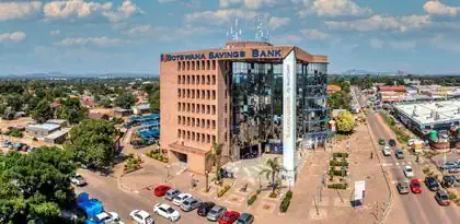 Ondulating glass facade and trellissed roof structure modern design of Botswana Savings Bank headquarters