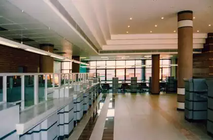 Interior design of modern bank building with glass and steel by Pantic Architects