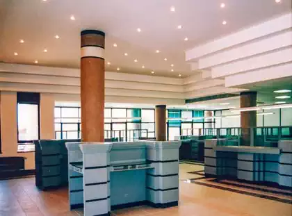 Interior design of modern bank hall with glass and steel by Pantic Architects