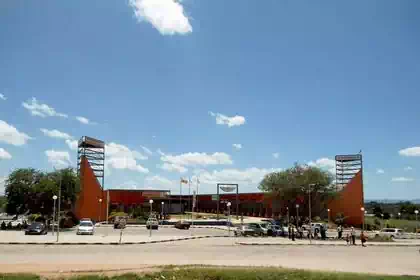 Symmetrical tower on both sides of shopping centre complex with Rd in front in Bindura