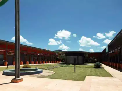Central green area with vegetation in Chipindura Walk Shopping centre in Bindura. Retail plans by local architect