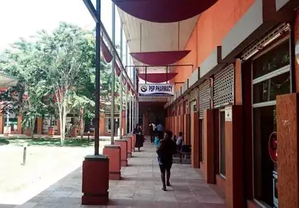 Covered shaded walkway next to shops and trees in Chipindura walk Shopping Centre