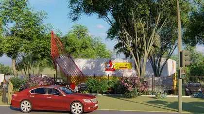 Distinctive Electrosales branded warehouse shop with metal red structure designed by Harare architect