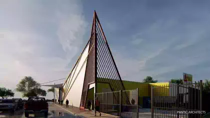 Distinctive Electrosales branded warehouse shop with metal red structure designed by Harare architect