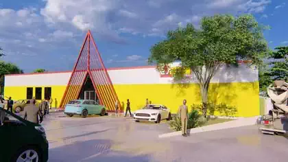 Distinctive Electrosales branded warehouse shop with metal red structure designed by Harare architect
