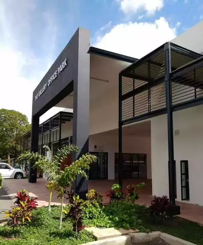 Main entrance portal to gallery and office complex with louvred walkway to protect from rain and sun. Project by Pantic Architects