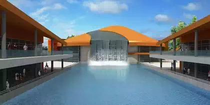 Waterfall on stylish fun orange roofed building in shopping centre in Kinshasa, DRC