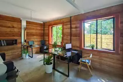 Internal view of office in rammed earth walls and screed floors in Zimbabwe