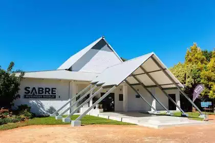 Cool triangular modern add-on steel canopy to existing building for monumental entrance to Sabre Business centre. Office space design by interior designers