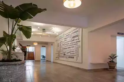Reception area with slogan wall in Sabre conferencing facility in Harare