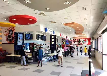 Distinctive branding and colours in food court in service station in Rusape
