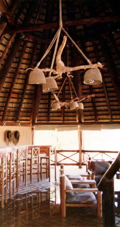 Gumpole and thatch roof lodge buildings part of Detema Lodge in Dete by Pantic Architects
