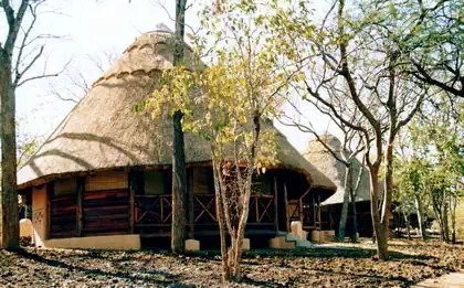 Gumpole and thatch roof lodge buildings part of Detema Lodge in Dete by Pantic Architects