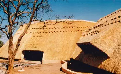 Large thatched roof entrance with engraved elephant lodge in Zimbabwe