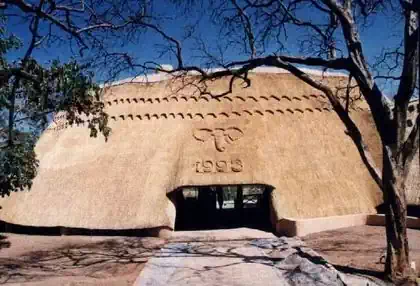 Gumpole and thatch roof lodge buildings part of Detema Lodge in Dete by Pantic Architects