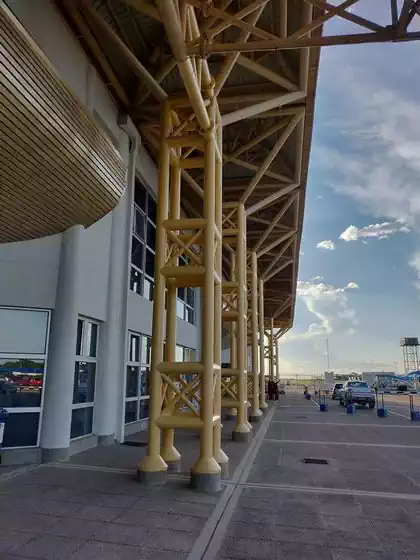 Line of columns supporting entrance canopy to Joshua Nkomo International Airport building