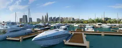 Boats in Marina, skyscrapers in background on proposed islands in La Cite du Fleuve, Kinshasa