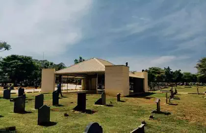 Modern serene chapel amongst graves in Serene newly built graveyard with tombstones in Leopard's Hilil Memorial Park, Lusaka 