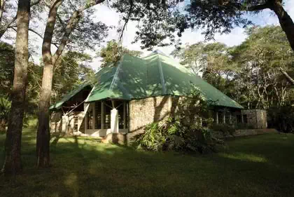 Intimate shaded area in between rocks and trees in private church