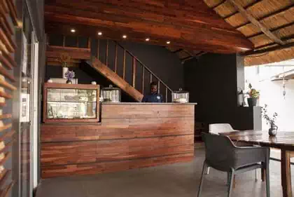 Trauma cafe interior design within existing thatched building. Architectural interior designer engaged from Zimbabwe architects Pantic architects