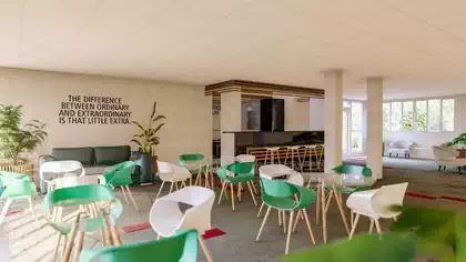 Open kitchen serving casual meeting tables and spaces in Harare office space