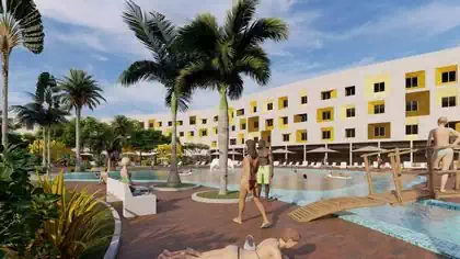 Poolside view of 200 room luxury hotel with multicoloured window openings and bridges over pool