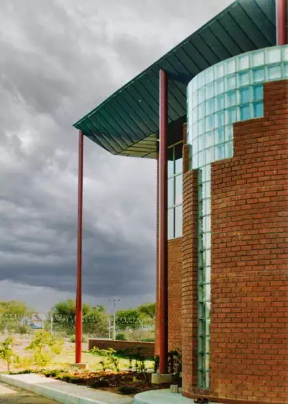 Modern glass and face-brick minimalist office building. BBS Computer Centre designed by local architect