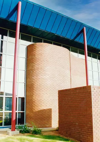 Large overhanged roof on glass and brick modern office computer centre in Gaborone, Botswana