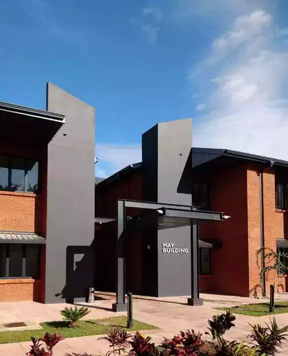 Modern entrance of office architecture with floating cantilevered steel canopy. Designed by Harare office architect 