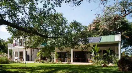 Continous view through house to entrance from pool. Cape dutch house designed by harare architect