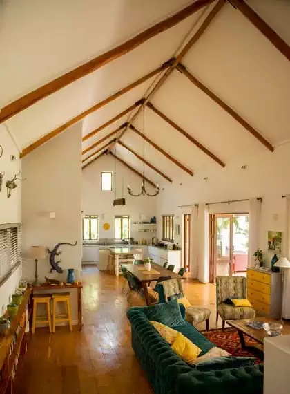 Enormous internal living space with open space kitchen and living area overlooking veranda designed by harare architect