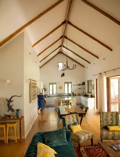 Exposed ceiling rafters in modern cape dutch house design in Harare