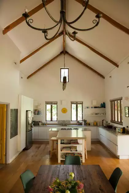 Large kitchen space and internal volume in modern house. Cape dutch house designed by harare architect