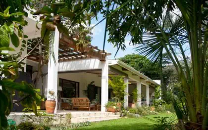 Large covered veranda on caoe dutch house design in Harare