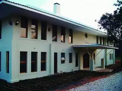 Modern house in Lusaka Zambia. Large windows and covered entrance with overhangs to protect from sun 