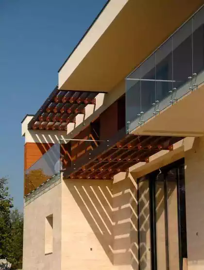 Brise-soleil louvres as sun shades preventing penetration of hot sun on modern house in Avala, Serbia