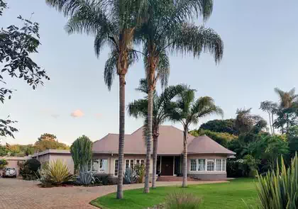 Circular house design next to new modern house. Design by architect from Harare