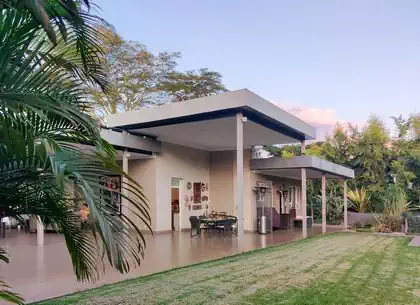 Overhanging roof detail of modern house in Zimbabwe. Outside living and kitchen areas