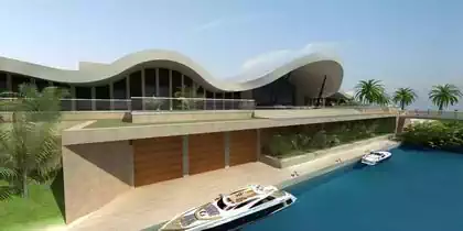 Ocean villa with undulating roof with boat mooring and garage. Palm trees and vegetation integrated into house design by Zimbabwe architect